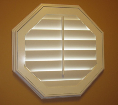 Southern California octagon window with white shutter